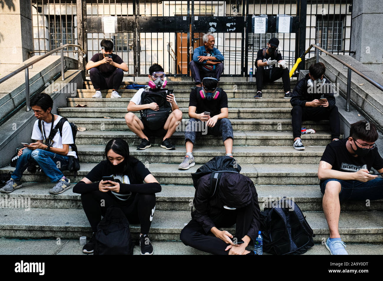 Hong Kong, China. 18th Nov, 2019. Protesters take a rest during a protest in Jordan district of Hong Kong, China. As a standoff continued in Hong Kong, protesters clashed with police near Hong Kong Polytechnic University in Kowloon, leading to multiple arrests and injuries. Credit: Keith Tsuji/ZUMA Wire/Alamy Live News Stock Photo