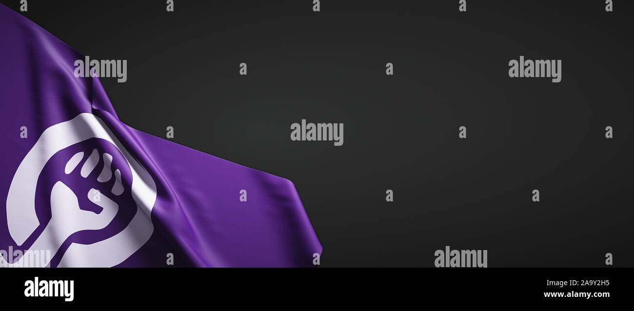 Cloth feminist flag on dark background Stock Photo