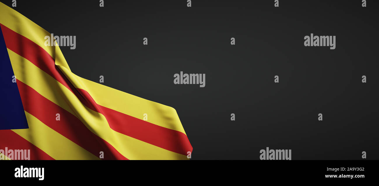 Flag of Catalonia made of cloth on dark background Stock Photo
