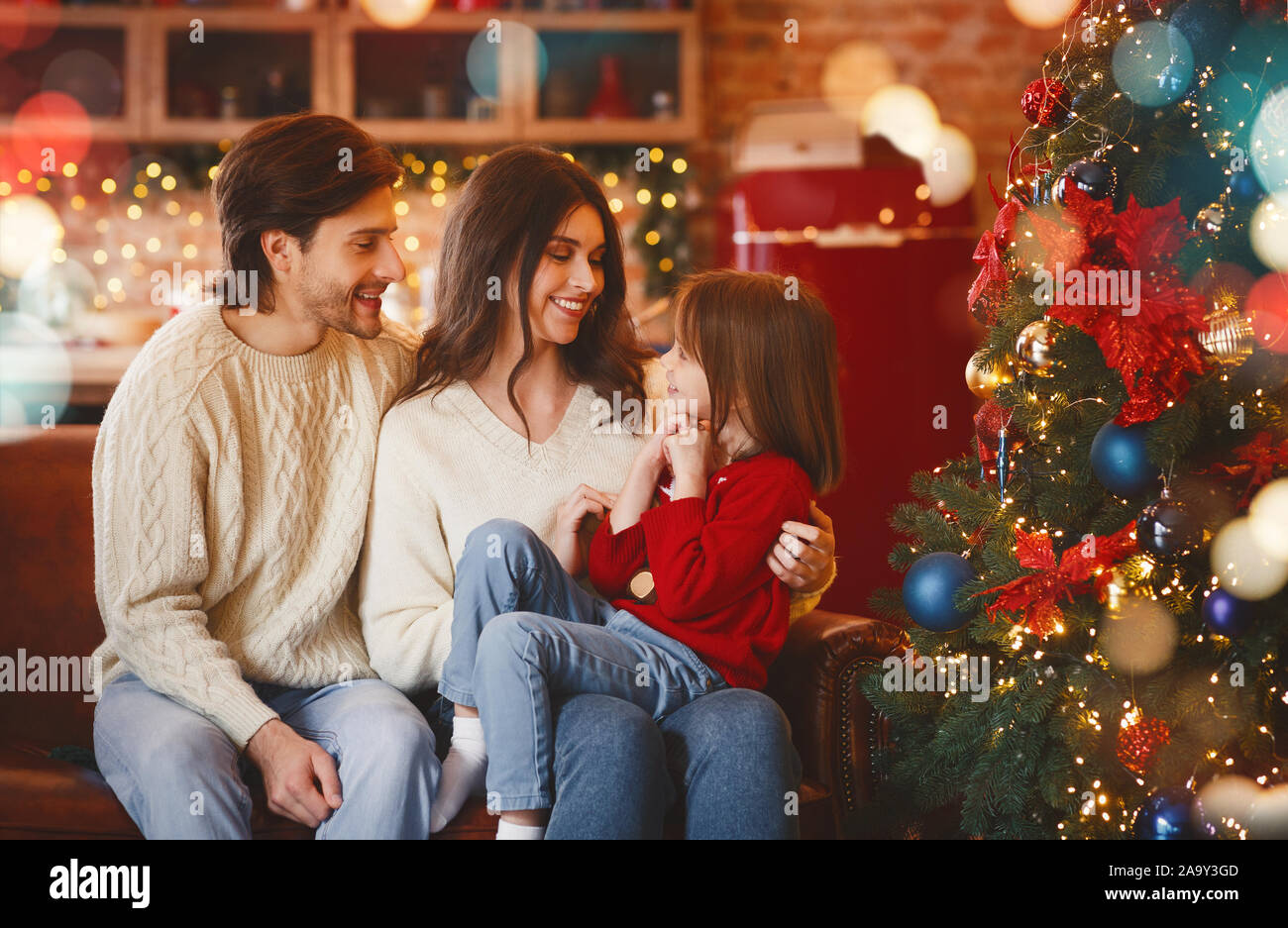 Friendly family spending winter holidays Christmas, New Year together Stock Photo
