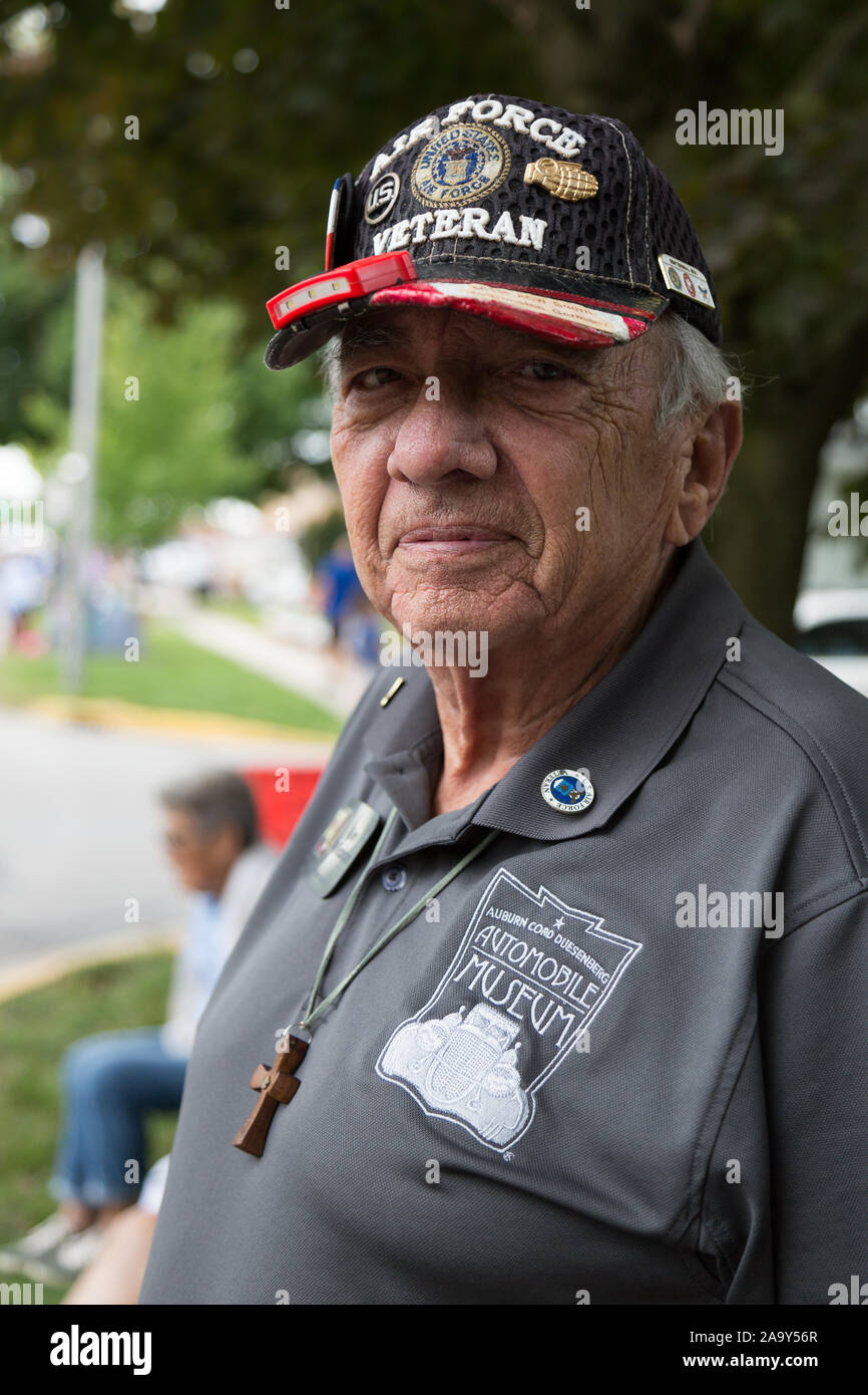 A proud United States Air Force veteran stands along the parade route in Auburn, Indiana, USA. Stock Photo
