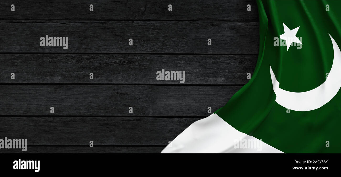 Flag of Pakistan, fabric on dark wood Stock Photo - Alamy