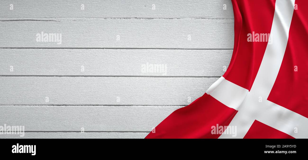 Denmark flag, on top of white wood. Wrinkled fabric Stock Photo - Alamy