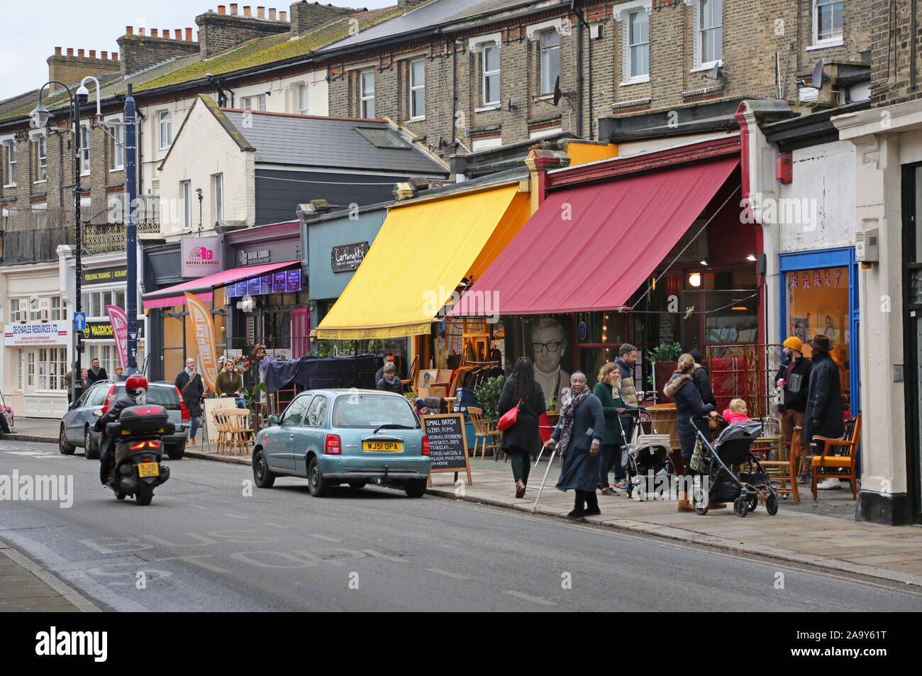 Second hand shops on Church Road in Crystal Palace, south London, UK. Shops selling used furniture, clothes, records and household bric-a-brac. Stock Photo