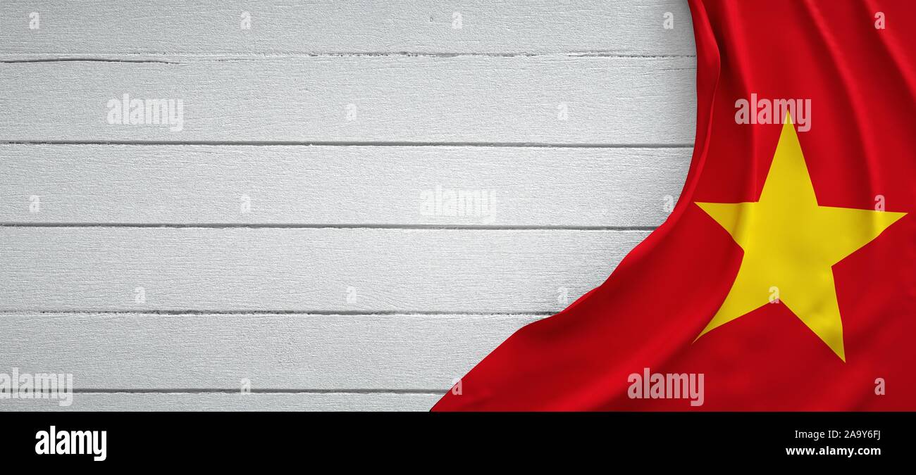 Flag of Vietnam, on top of white wood. Wrinkled fabric Stock Photo - Alamy