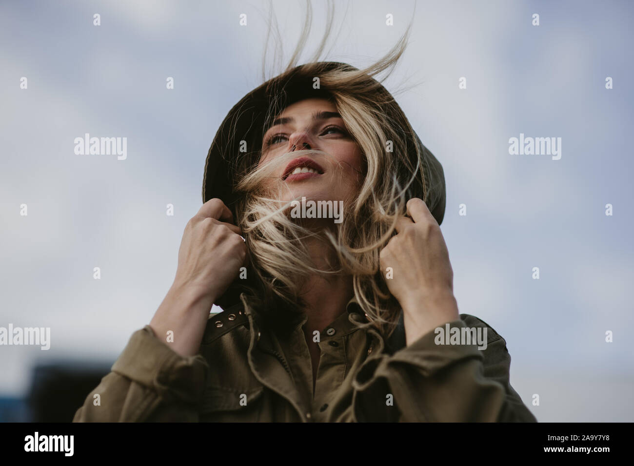 Woman in hood hi-res stock photography and images - Alamy