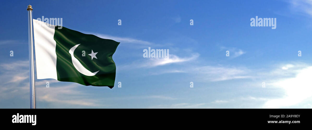 Flag of Pakistan rise waving to the wind with sky in the background ...