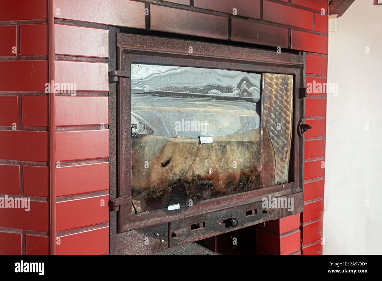 Fireplace For Wood Broken Glass In Old House Close Up Stock Photo