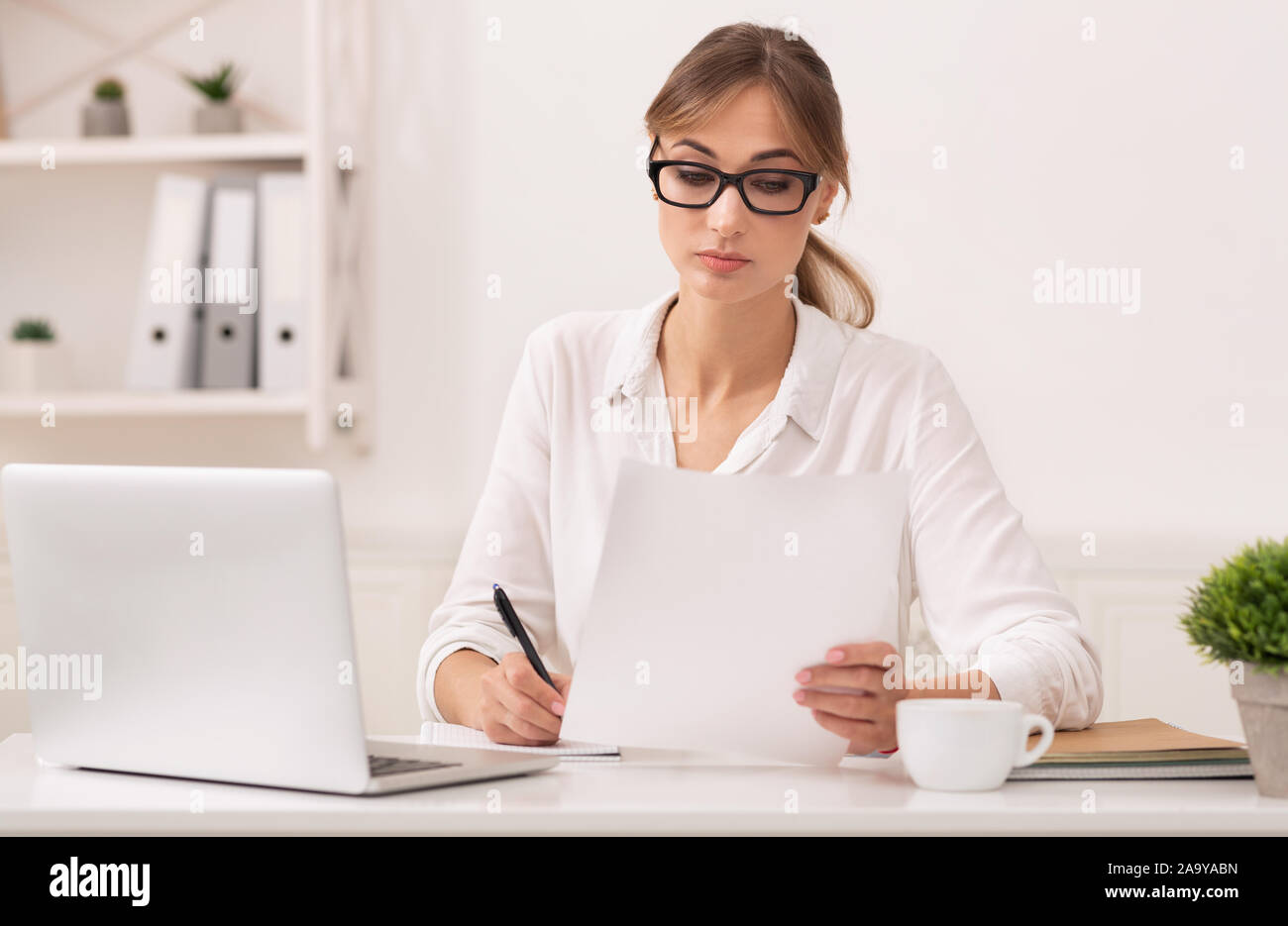 Offcice Note Taking Office Girl Reading Business Report Taking Notes Sitting At Workplace ...