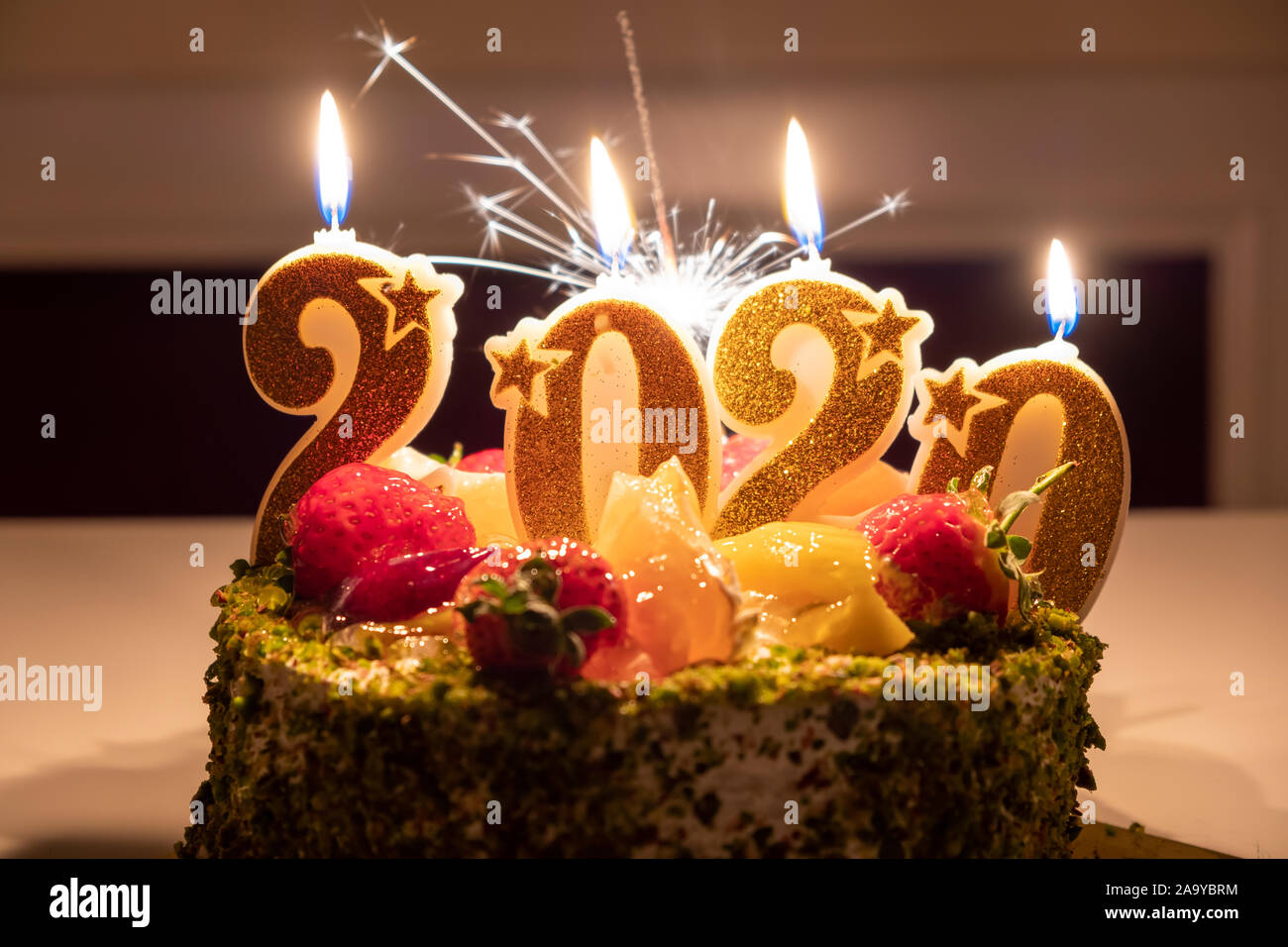 Close up of birthday cake with candles shaped number 2020. Happy ...