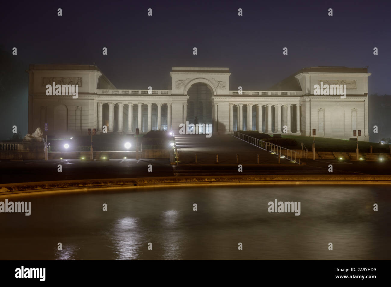 Façade, stairway and fountain of the Legion of Honor on a foggy autumn night Stock Photo