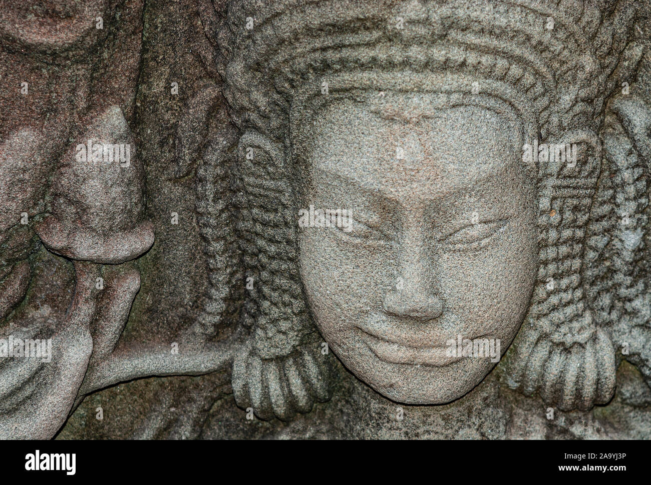 Stone carving of a face at the famous Angkor Wat Temple in Cambodia Stock Photo Alamy