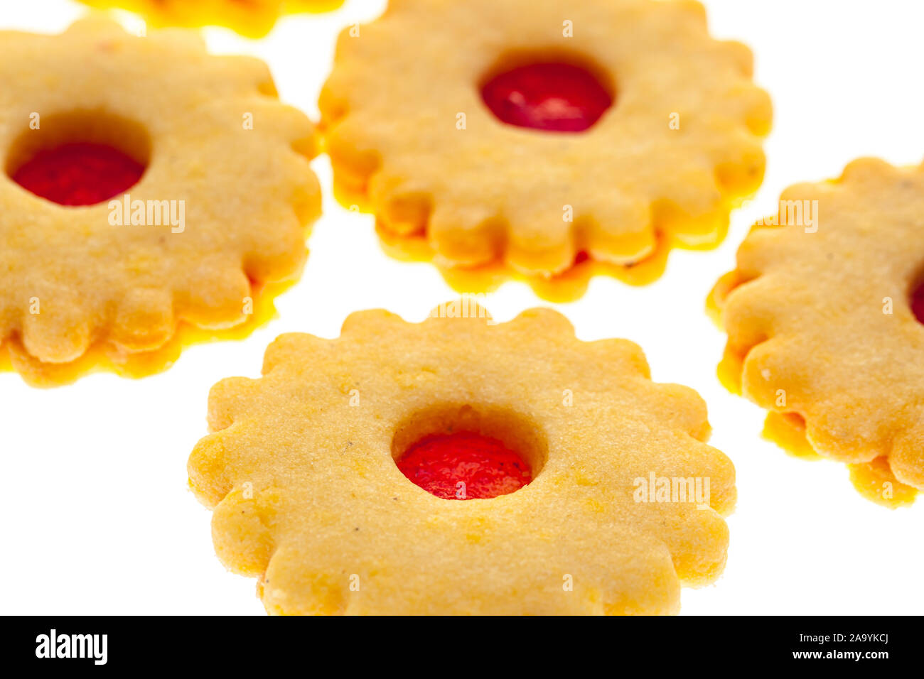 christmas cookies: several round Christmas cookies (Spitzbube) with strawberry jam Stock Photo
