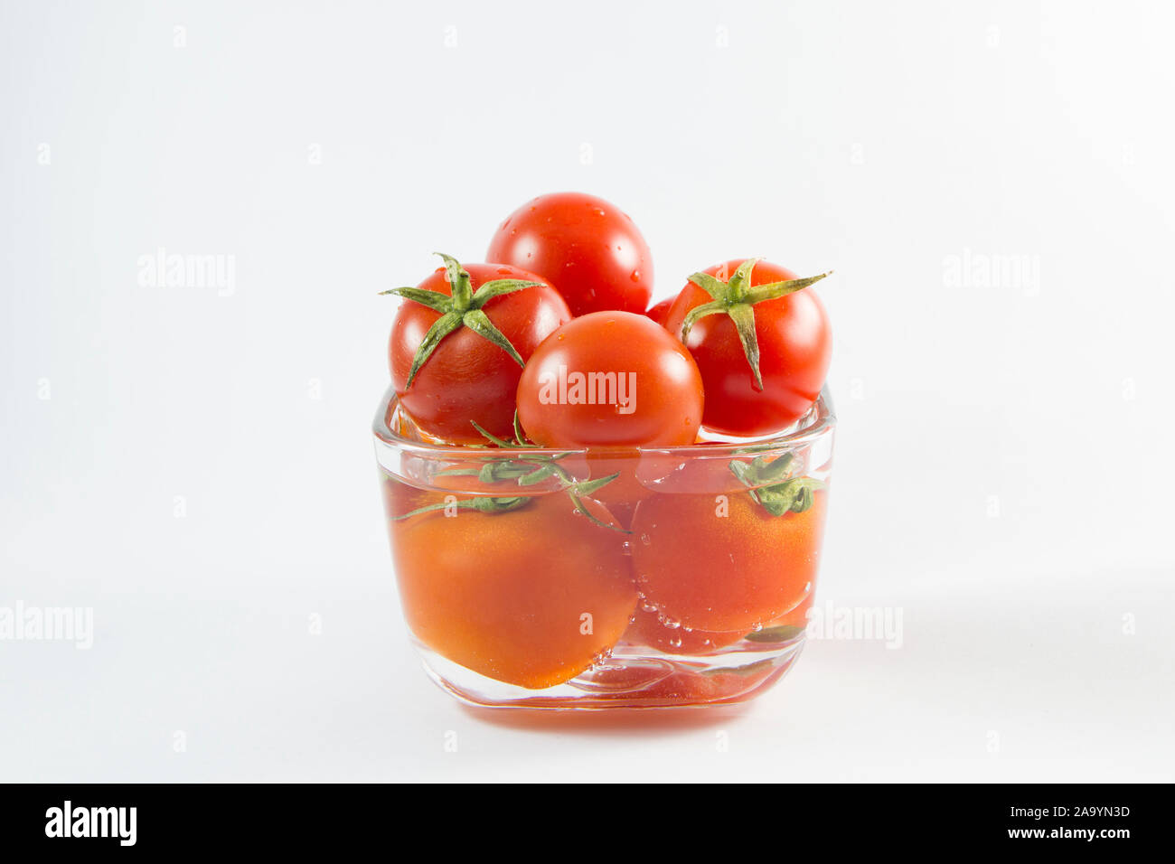 Fresh Tomatoes isolated on white background Stock Photo