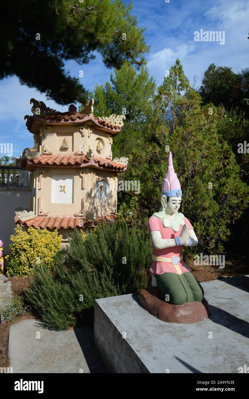 Tiered Pagoda & Buddhist Sculptures in the Vietnamese Buddhist Pagoda, or Pagode Phap Hoa, founded in 1978, in Marseille France Stock Photo
