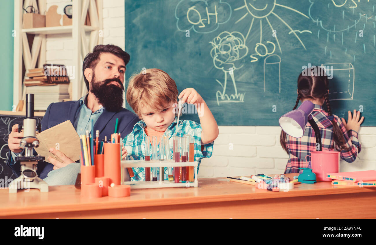 It is unbelievable. children making science experiments. Education. Science and education. chemistry lab. happy children teacher. back to school. doing experiments with liquids in chemistry lab. Stock Photo