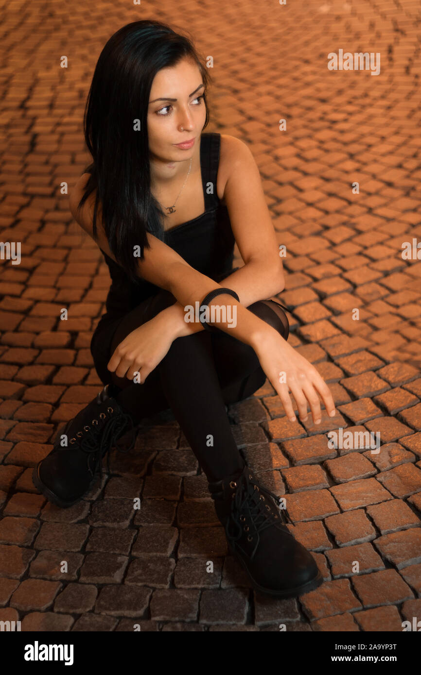 A girl sitting on the floor Stock Photo - Alamy
