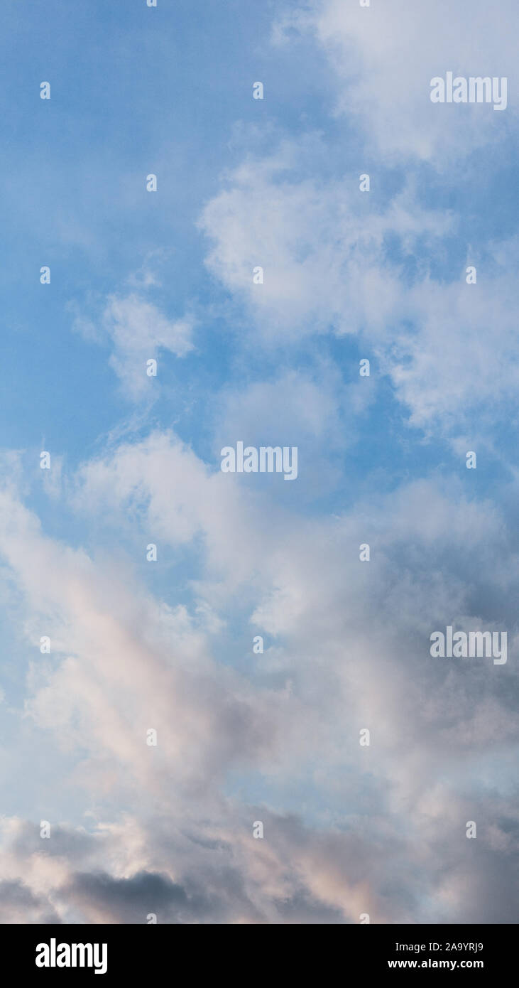 Blue sky with clouds just before sunset Stock Photo - Alamy