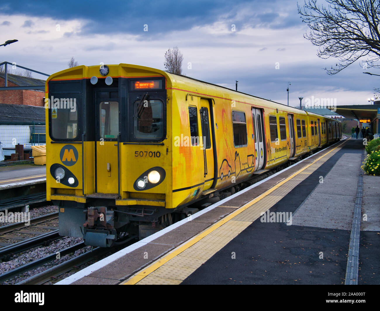 An electric commuter train at Hoylake Station on the Merseyrail rail transport network, a regional commuter network with Liverpool as its hub Stock Photo