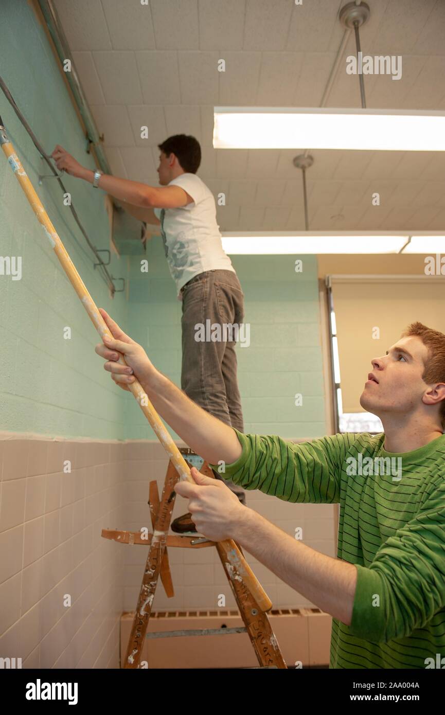 Students repair a school while participating in a service project during the Winter session or Intersession period at the Johns Hopkins University in Baltimore, Maryland, 2009. From the Homewood Photography collection. () Stock Photo