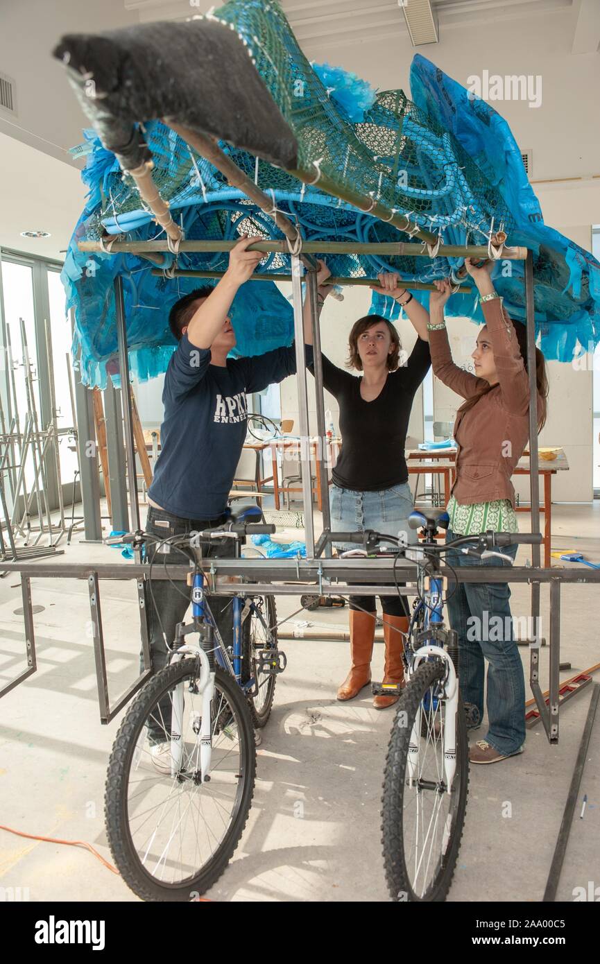 Students construct a Kinetic Sculpture using found materials, in the shape of the Bluejay mascot, while preparing to participate in the Baltimore Kinetic Sculpture Race, at the Johns Hopkins University in Baltimore, Maryland, 2009. From the Homewood Photography collection. () Stock Photo
