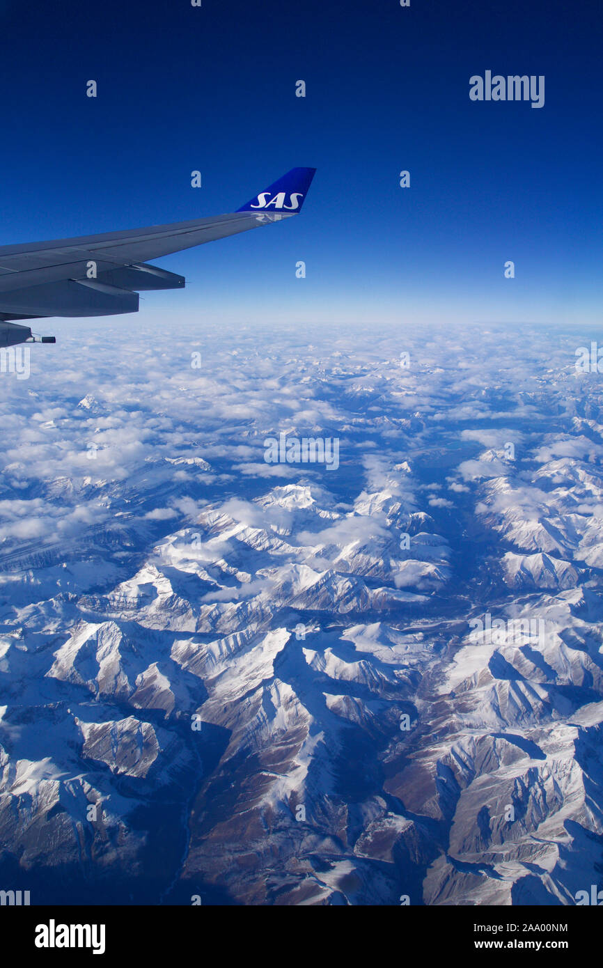 View from airplane window snow covered hi-res stock photography