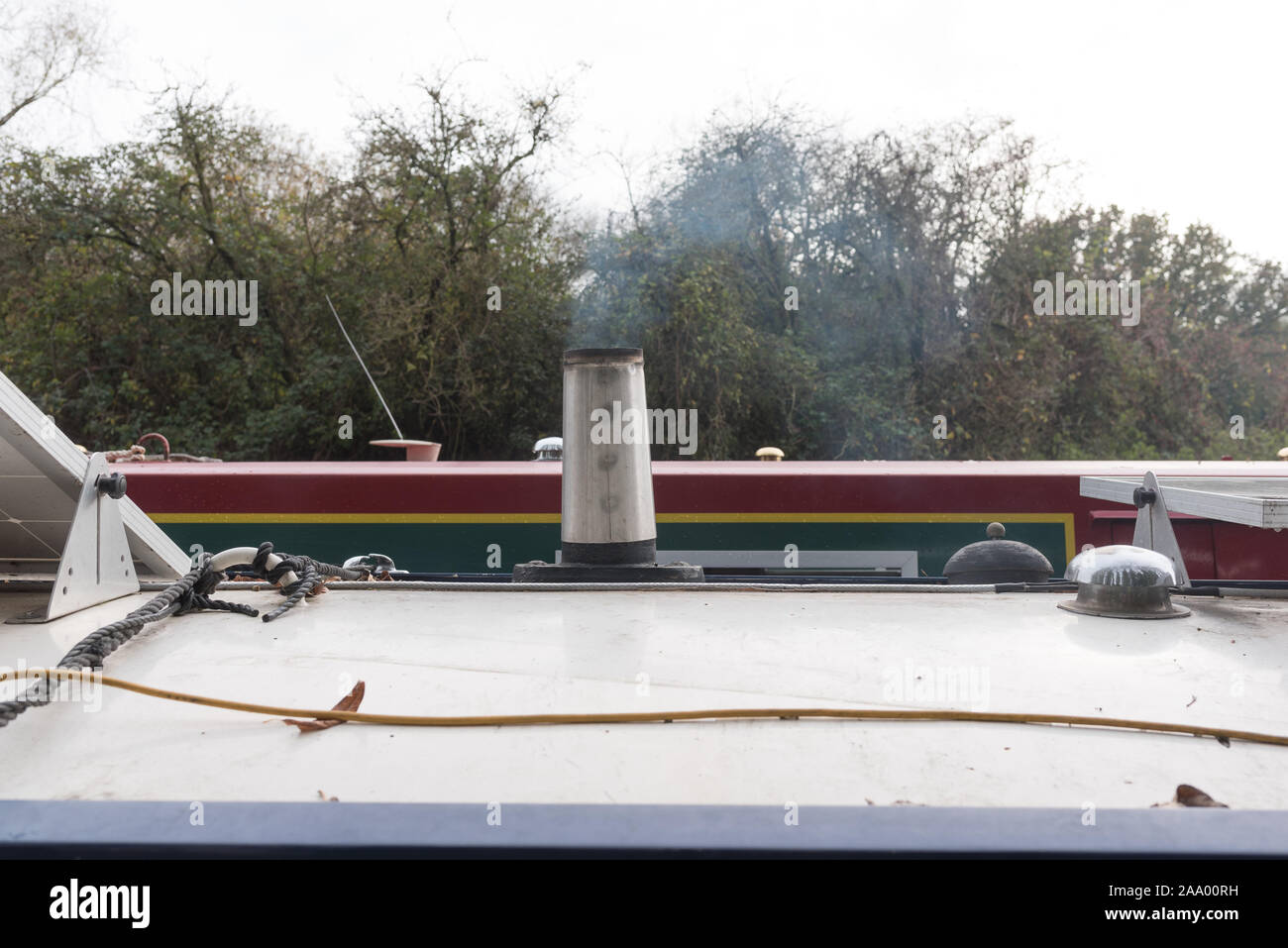 close up of log burner chimney on canal boat with shoke Stock Photo