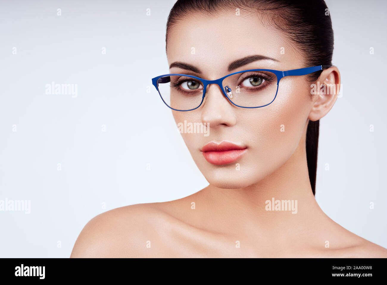 Woman with long eyelashes in eyeglasses. Vision correction. Poor eyesight. Spectacle frame. Makeup, cosmetics, beauty. Close up, macro Stock Photo