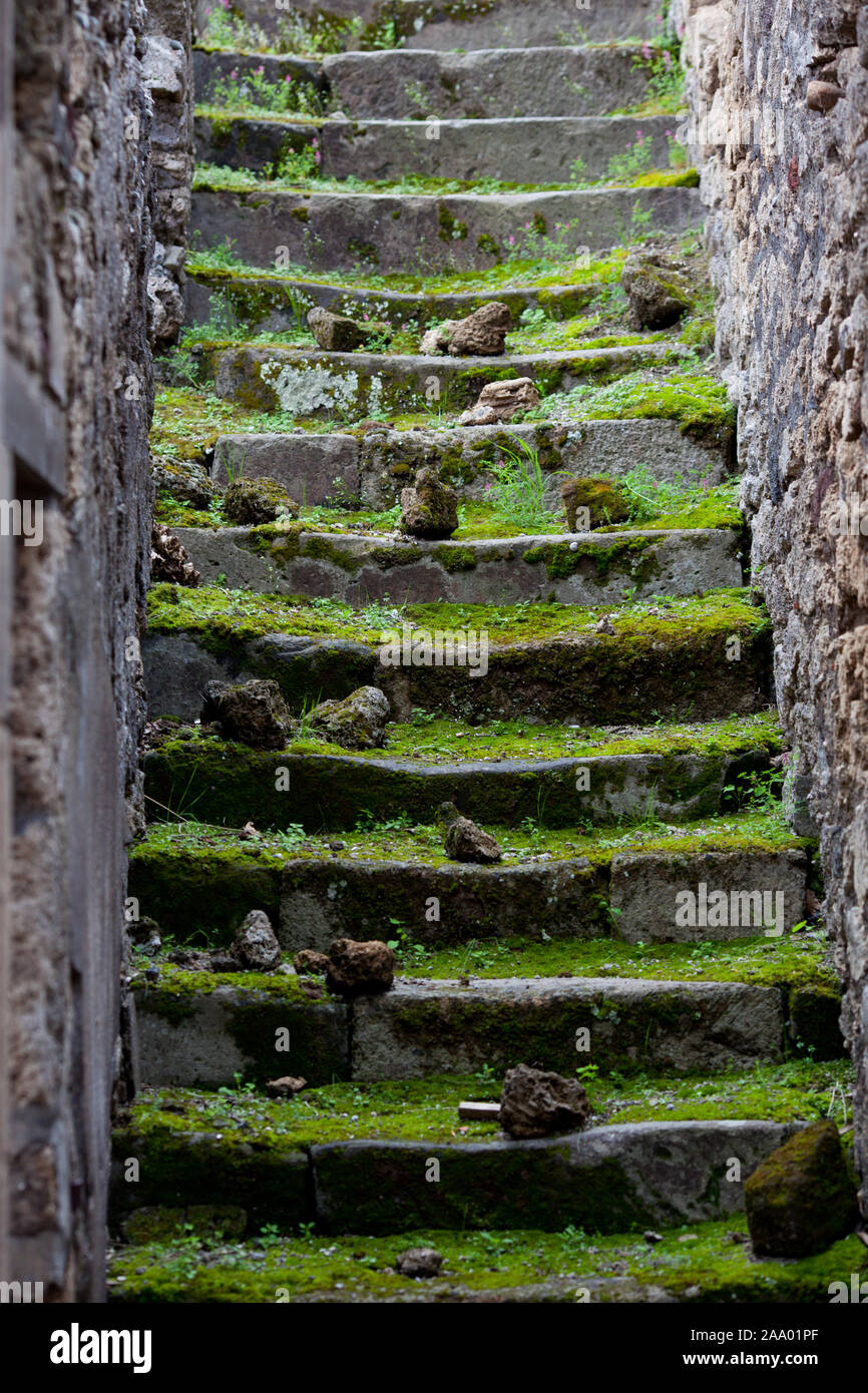 Stone steps covered with moss, ruins of Pompeii, Italy. Stock Photo