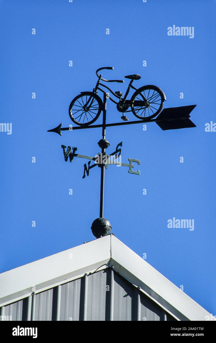 Bicycle weathervane at a bike shop and against blue sky on a rooftop,  Lancaster County, Pennsylvania, PA images US, USA, FS 16.74MB, 300ppi sign  Stock Photo - Alamy