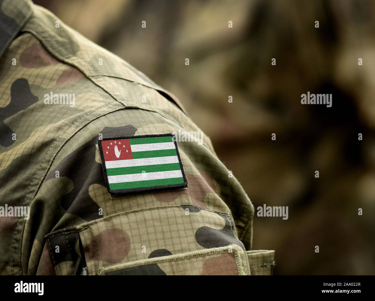 Flag of Republic of Abkhazia on military uniform. Army, armed forces, soldiers. Collage. Stock Photo
