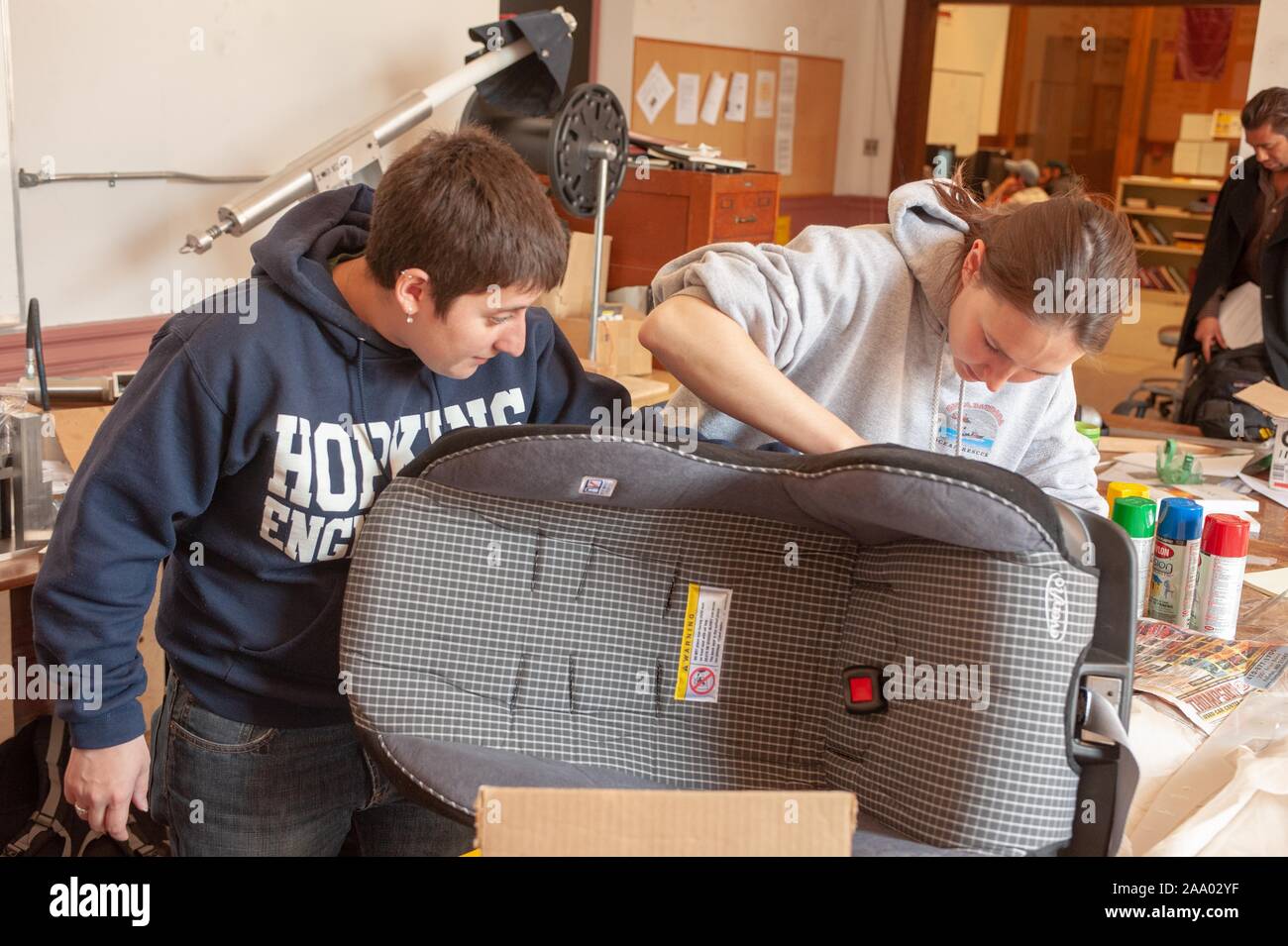 A pair of Whiting School of Engineering Design Team students work on a child's car seat project in a machine shop at the Johns Hopkins University, Baltimore, Maryland, March 31, 2009. From the Homewood Photography Collection. () Stock Photo