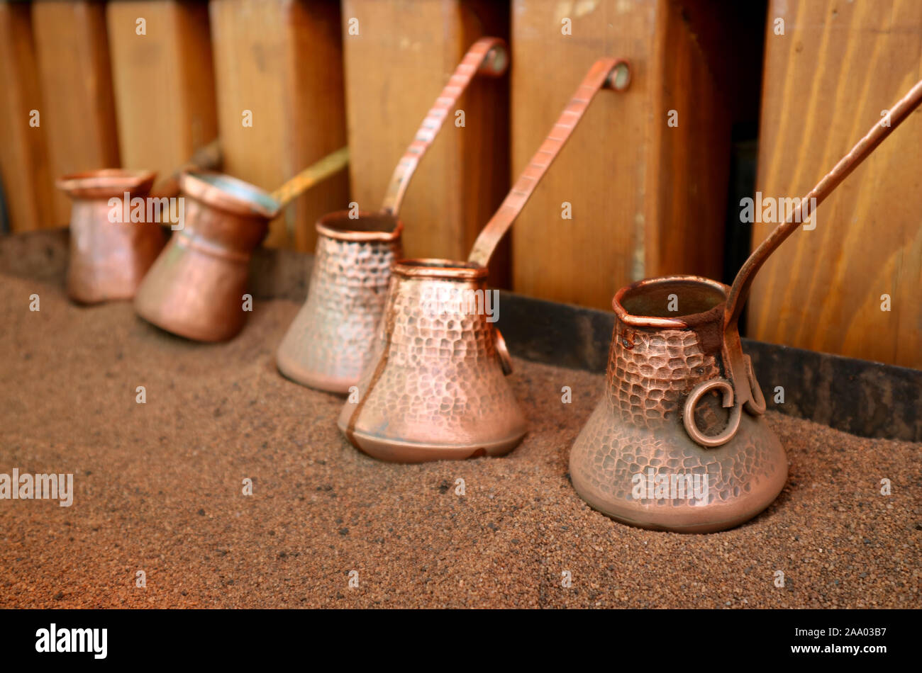 Closeup Turkish Coffee Boilers Placed on the Hot Sand Stock Photo