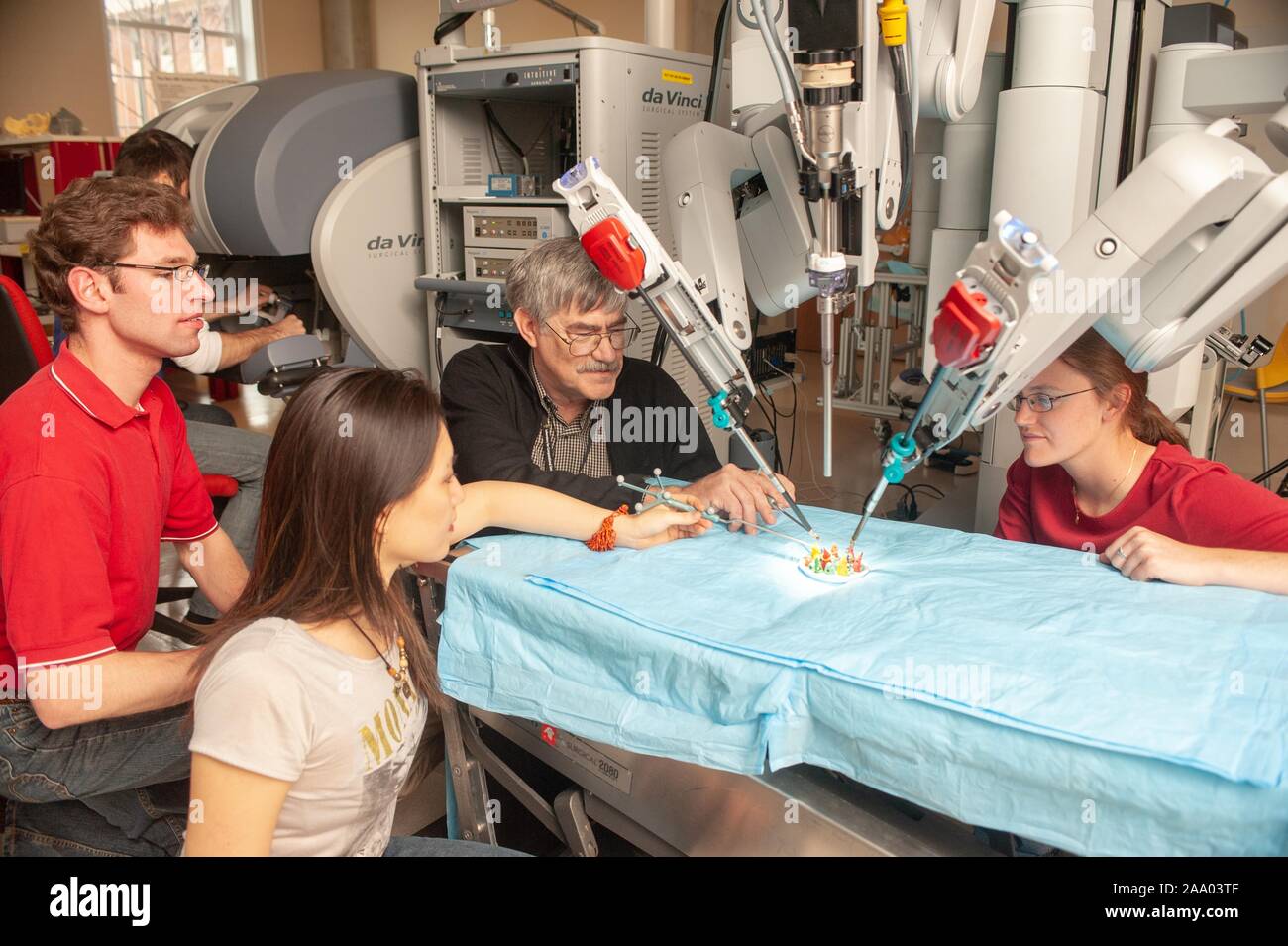 Whiting School of Engineering students watch Professor Russell Taylor, and a colleague, assisting a da Vinci Surgical Robot in a mock operation at the Johns Hopkins University, Baltimore, Maryland, April 6, 2009. From the Homewood Photography Collection. () Stock Photo