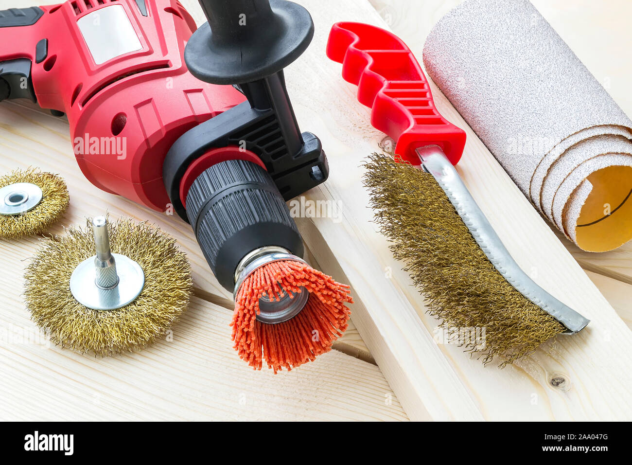 Drill, sandpaper and abrasive brushes with nylon and metal wire on a