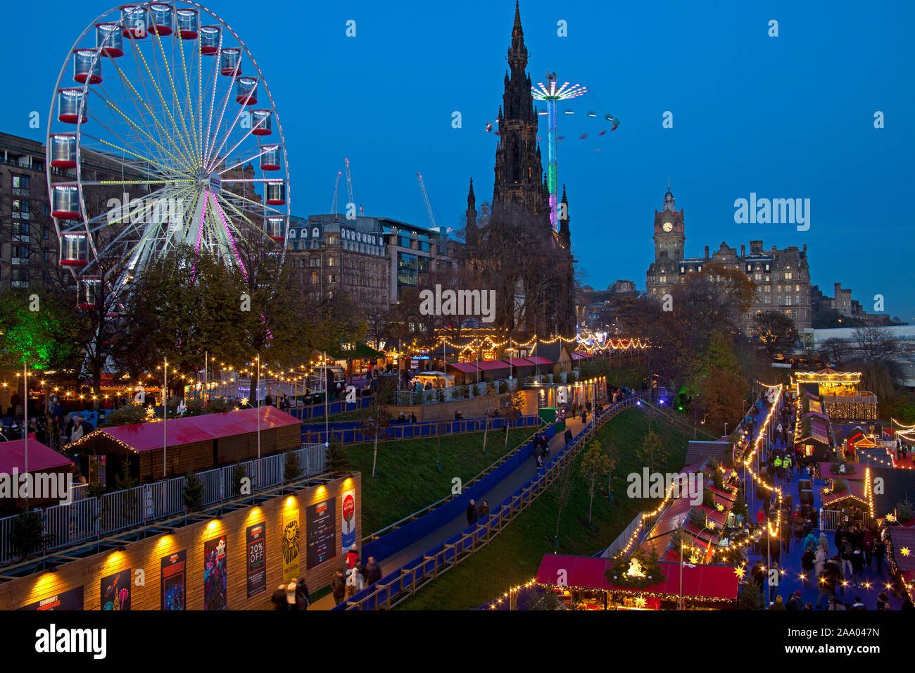 Princes Street Christmas Market and Fun Fair, Edinburgh, Scotland, United Kingdom. 18th Nov, 2019. Cold day but bright with temperature of 0 degrees by late afternoon, expected to drop to around minus 4 degrees overnight. Clear skies giving a beautiful twilight light to end the day. Stock Photo