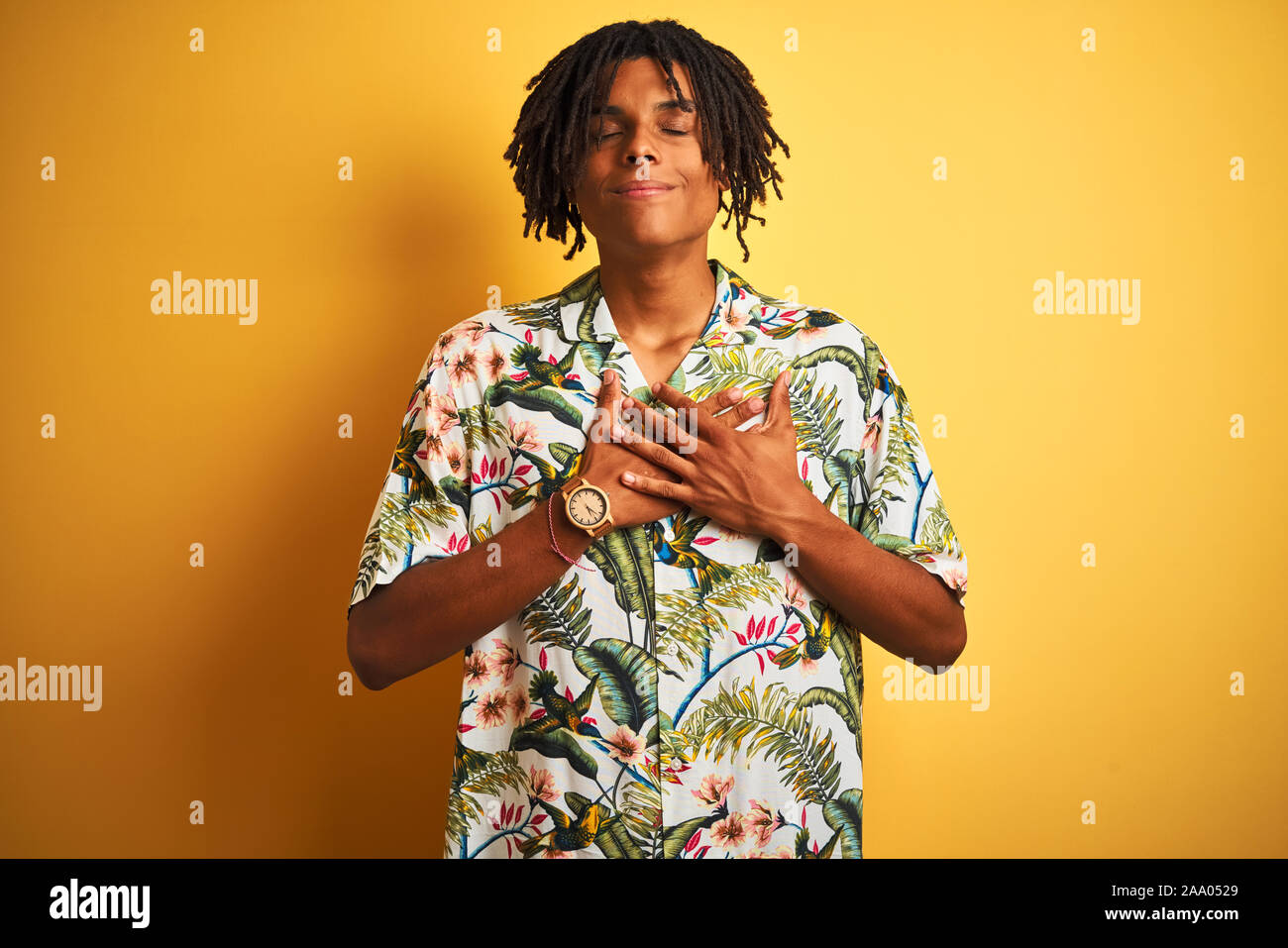 Dreadlocks Chest Afro man with dreadlocks on vacation wearing summer shirt over isolated ...