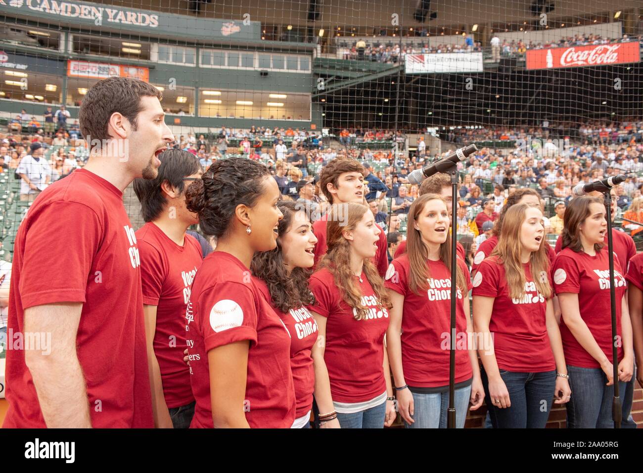 A musical group from the Johns Hopkins University in Baltimore, Maryland sings during a Baltimore Orioles Major League Baseball game, May 8, 2009. From the Homewood Photography collection. () Stock Photo
