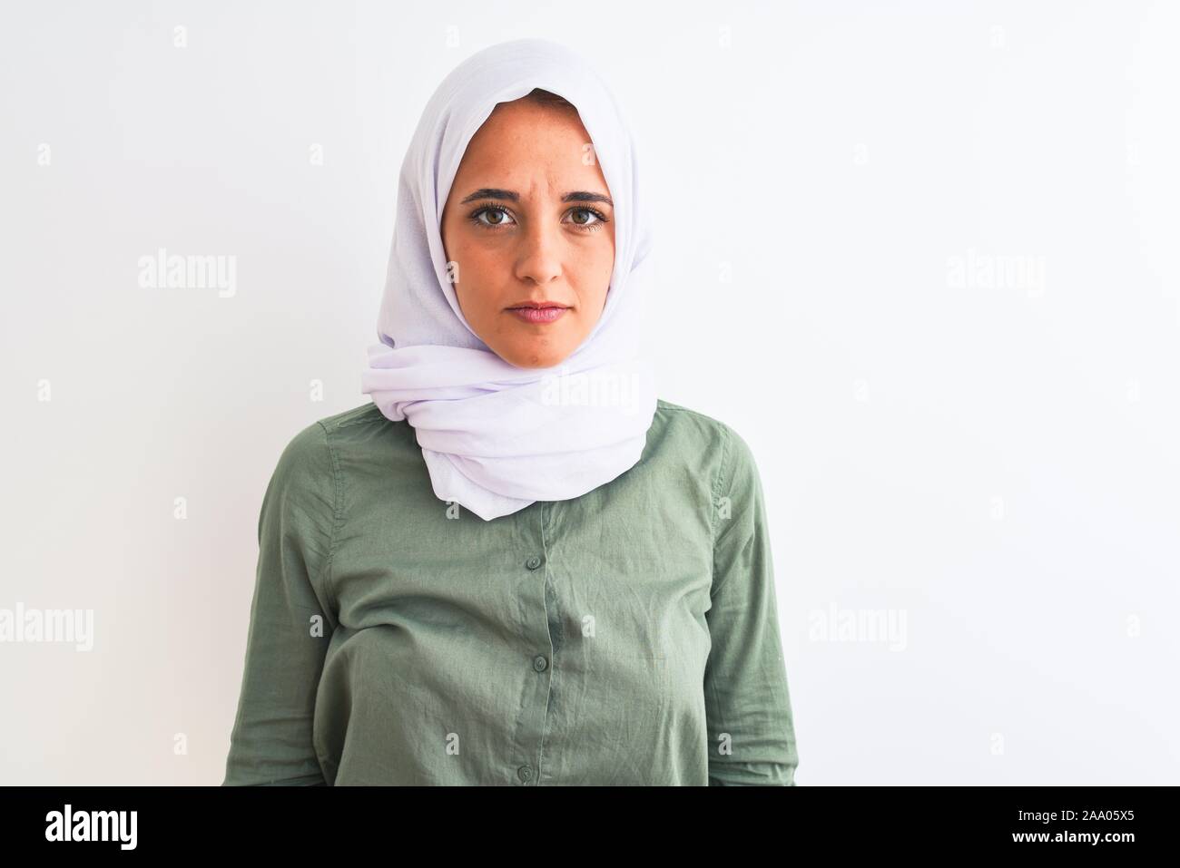 Young beautiful Arab woman wearing traditional Muslim hijab over