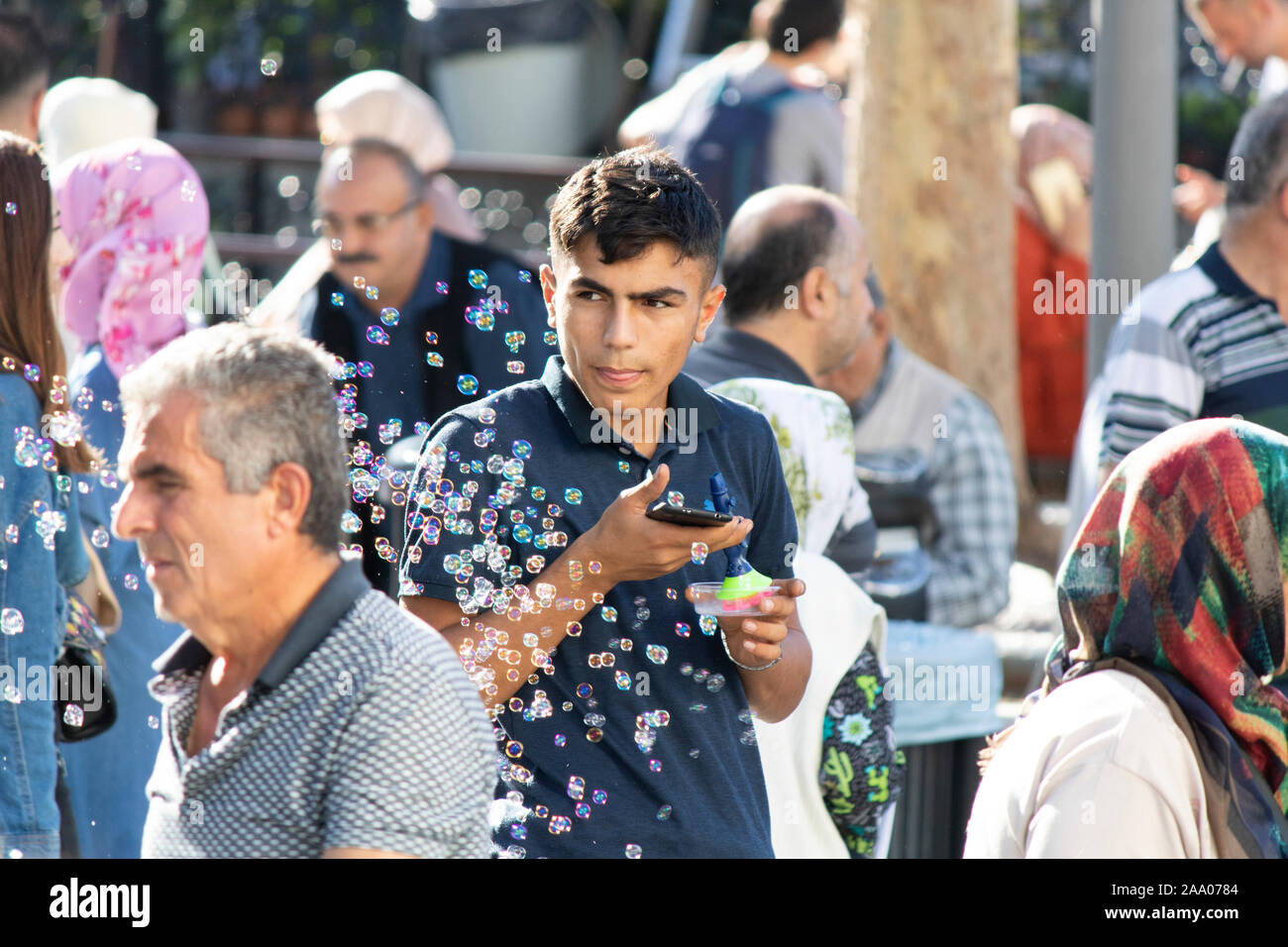 Istanbul, Turkey - September-28.2019: Child worker in Istanbul selling soap bubble machine Stock Photo