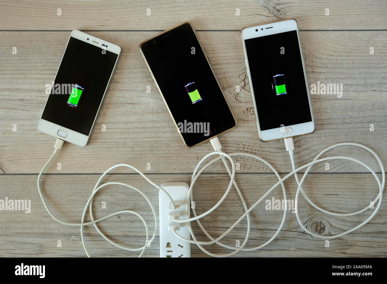 Smartphones are charged from the charger and lie side by side on the
