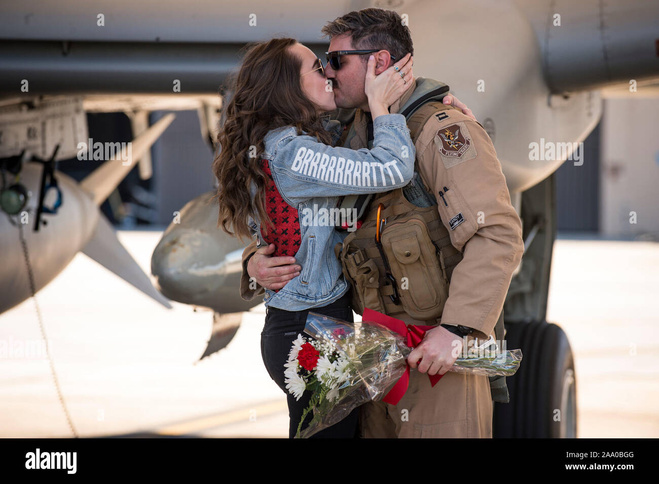 U.S. Air Force Capt. Daniel Lagomarsino, 75th Fighter Squadron A-10C Thunderbolt II pilot, and his girlfriend, Kacey Borden, share an embrace during a redeployment at Moody Air Force Base, Ga., Jan. 25, 2019.  The 75th FS returned from Southwest Asia after a six-month deployment in support of Operation Freedom's Sentinel. (U. S. Air Force photo by Andrea Jenkins) Stock Photo