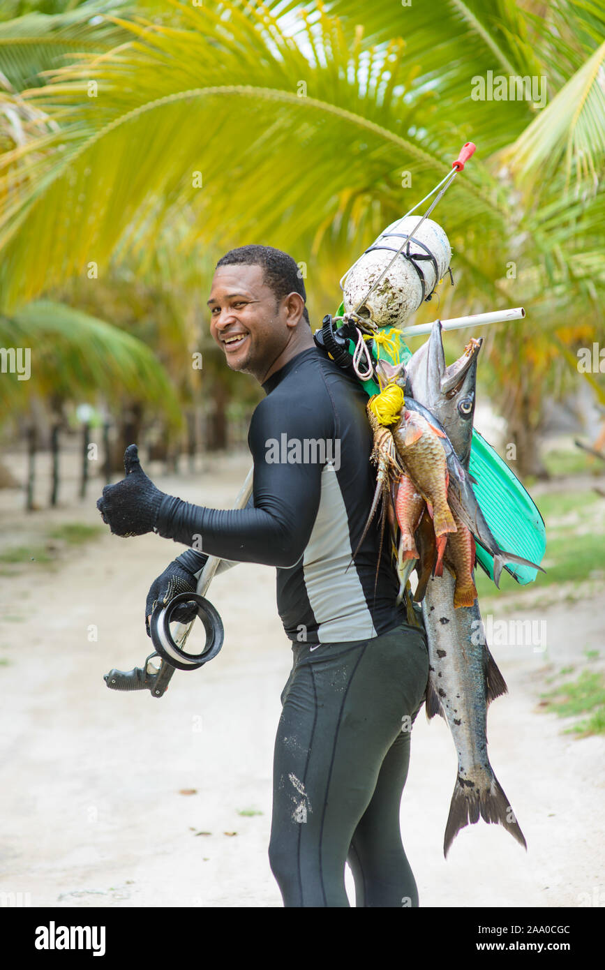 Spearfishing in the tropics. fisherman with a fish. Dominican Republic