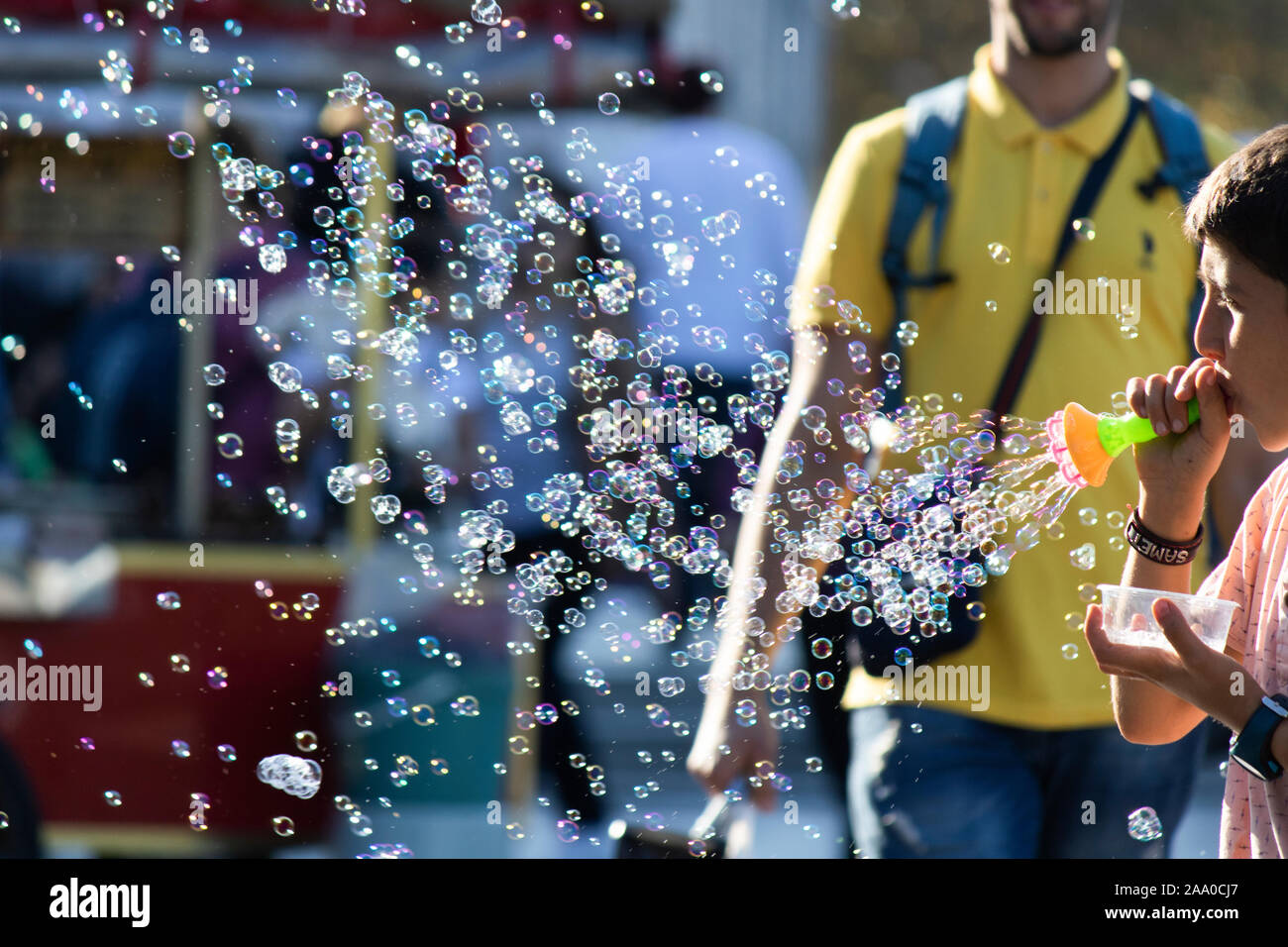 Istanbul, Turkey - September-28.2019: Child worker in Istanbul selling soap bubble machine Stock Photo