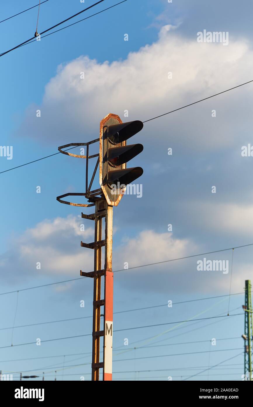 Railway signal light on a rusty post Stock Photo