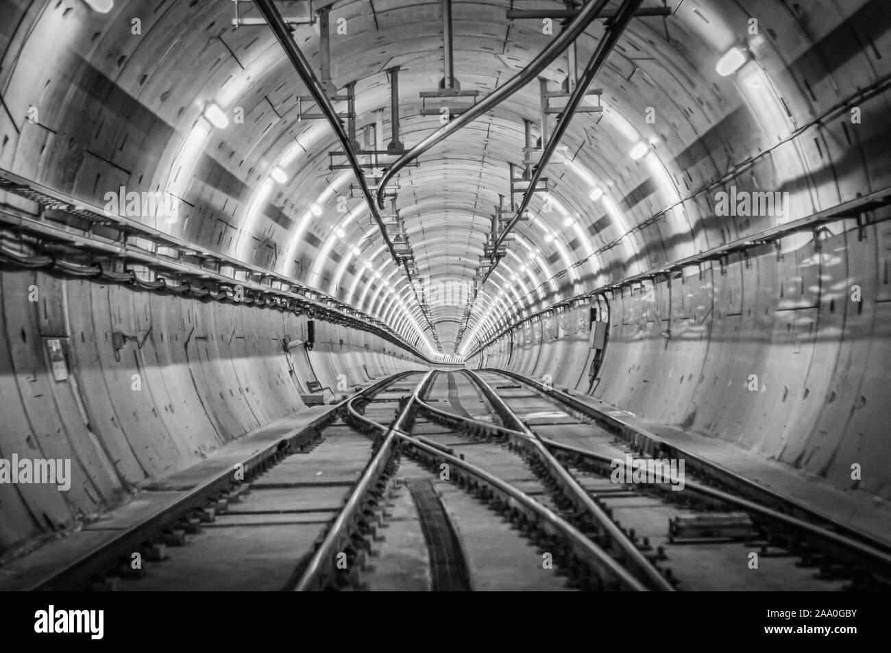 Two parallel railways in a concrete tunnel Stock Photo