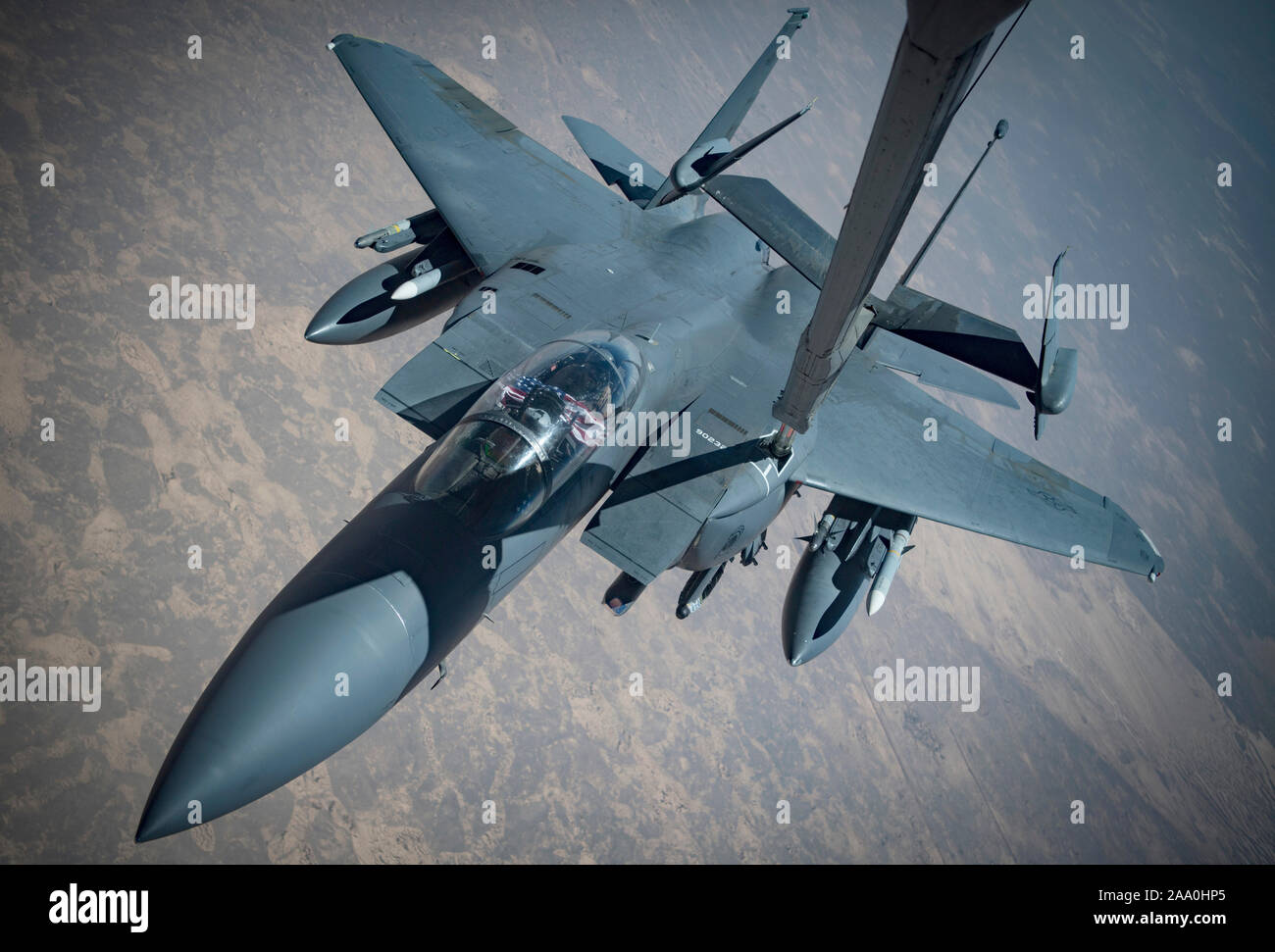 An F-15E Strike Eagle conducts aerial refueling with a KC-10 Extender from the 908th Expeditionary Air Refueling Squadron, July 2, 2019, within U.S. Central Command’s area of responsibility. The fighter aircraft performs air-to-air and air-to-ground missions using the pilot to detect, target and engage aerial threats and a weapons system officer to designate ground targets. The F-15 is an all-weather, extremely maneuverable, tactical fighter designed to permit the Air Force to gain and maintain air superiority over the battlefield. Stock Photo