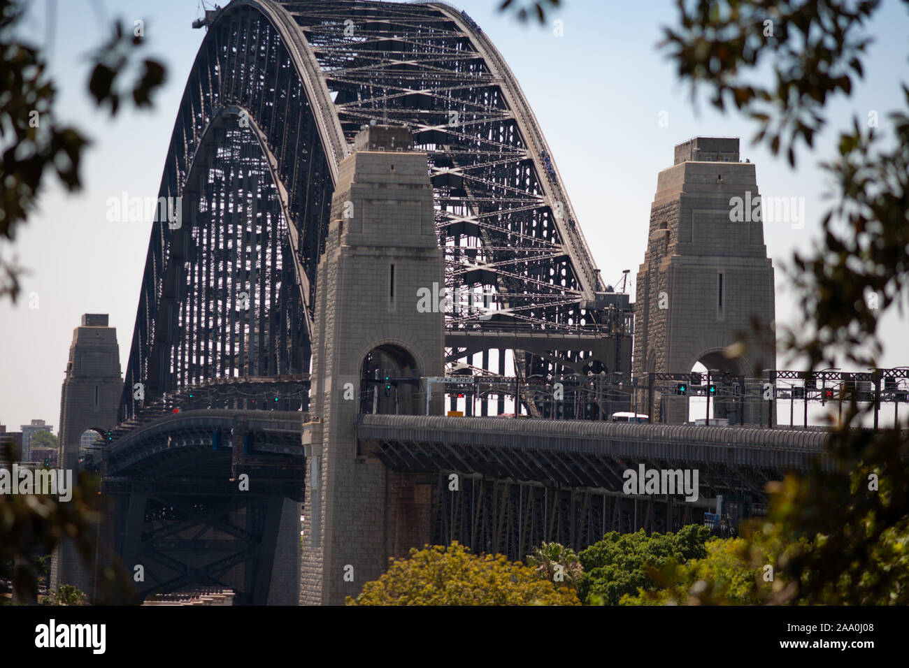 Sydney Harbour Bridge looking over terrace houses of the Rocks towards Milsons Point in the middle of the day Stock Photo