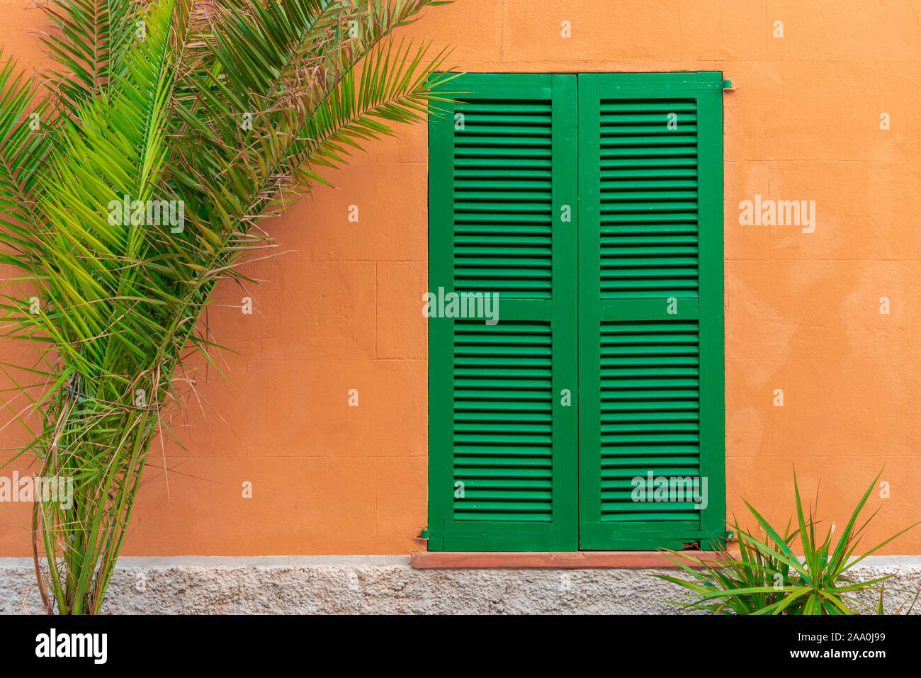 Spanish house with green shutters in beautiful Majorca island. Balearic