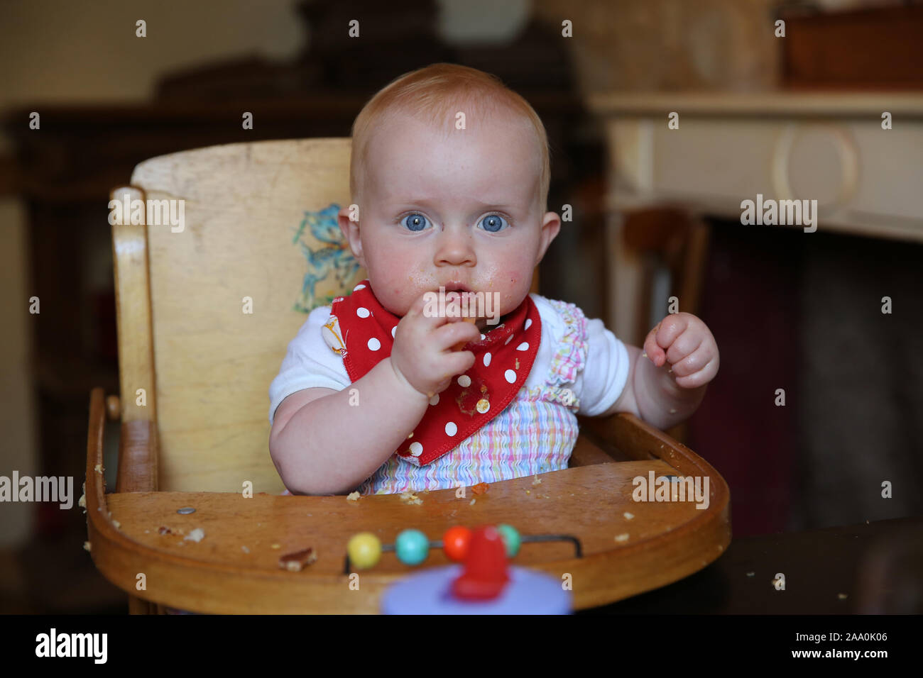 10 month old baby eating in restaurant Stock Photo - Alamy